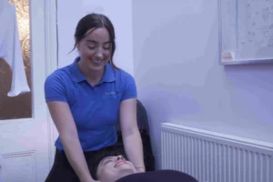 Chiropractor performing a Swedish massage on patient at chiropractic clinic